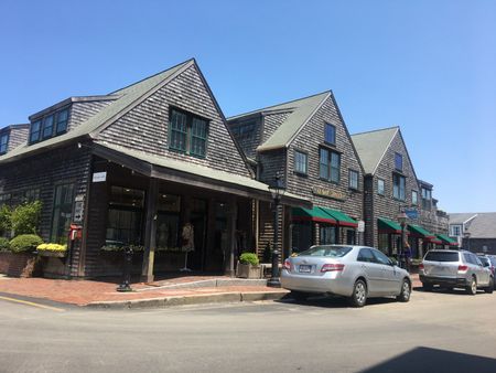 4 commercial units with 2 apartments above.